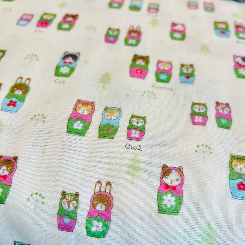 Nesting Dolls on Off White with Pink and Green on Double Gauze from Kokka